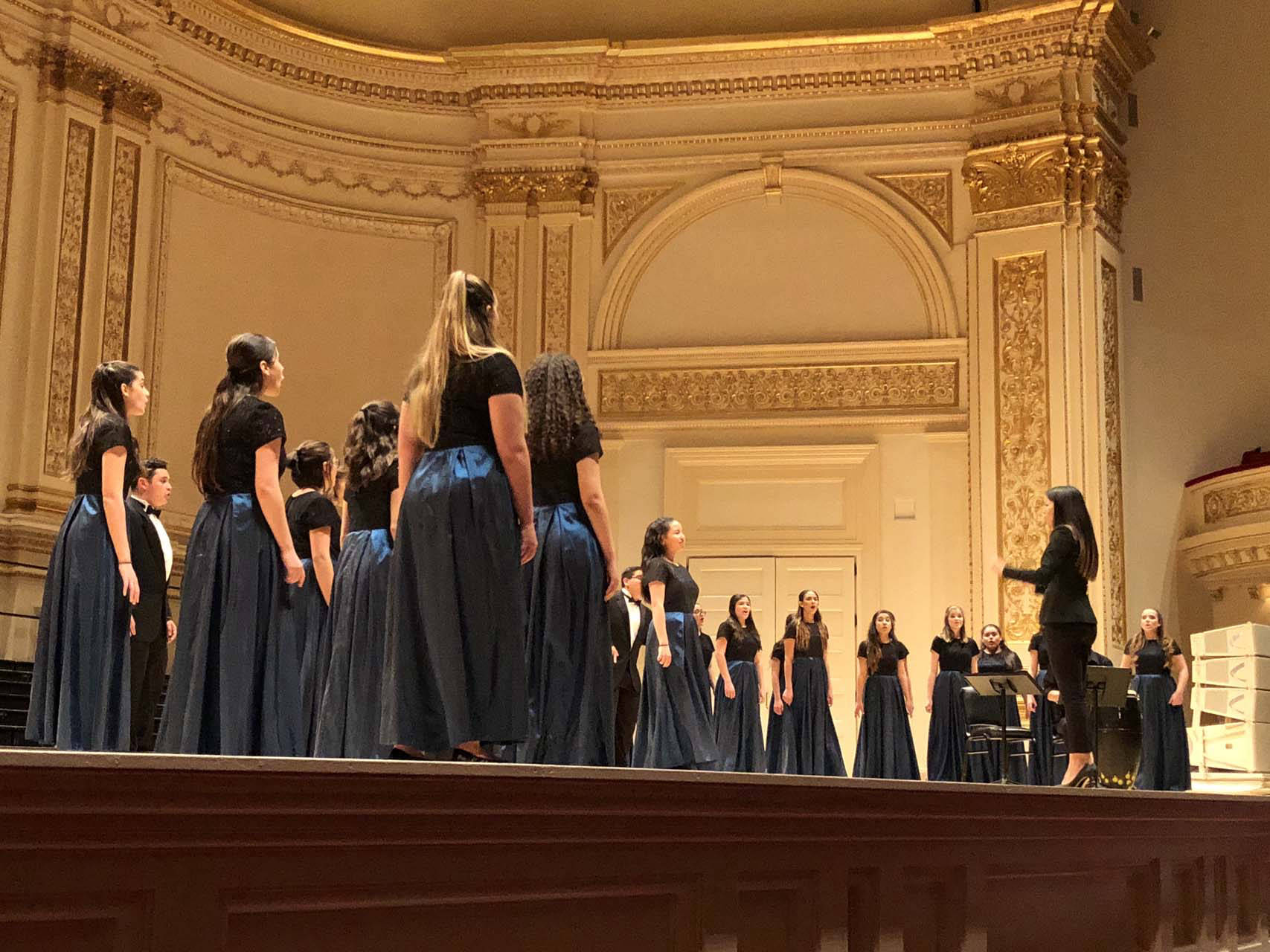 Chorus performing at a beautiful venue